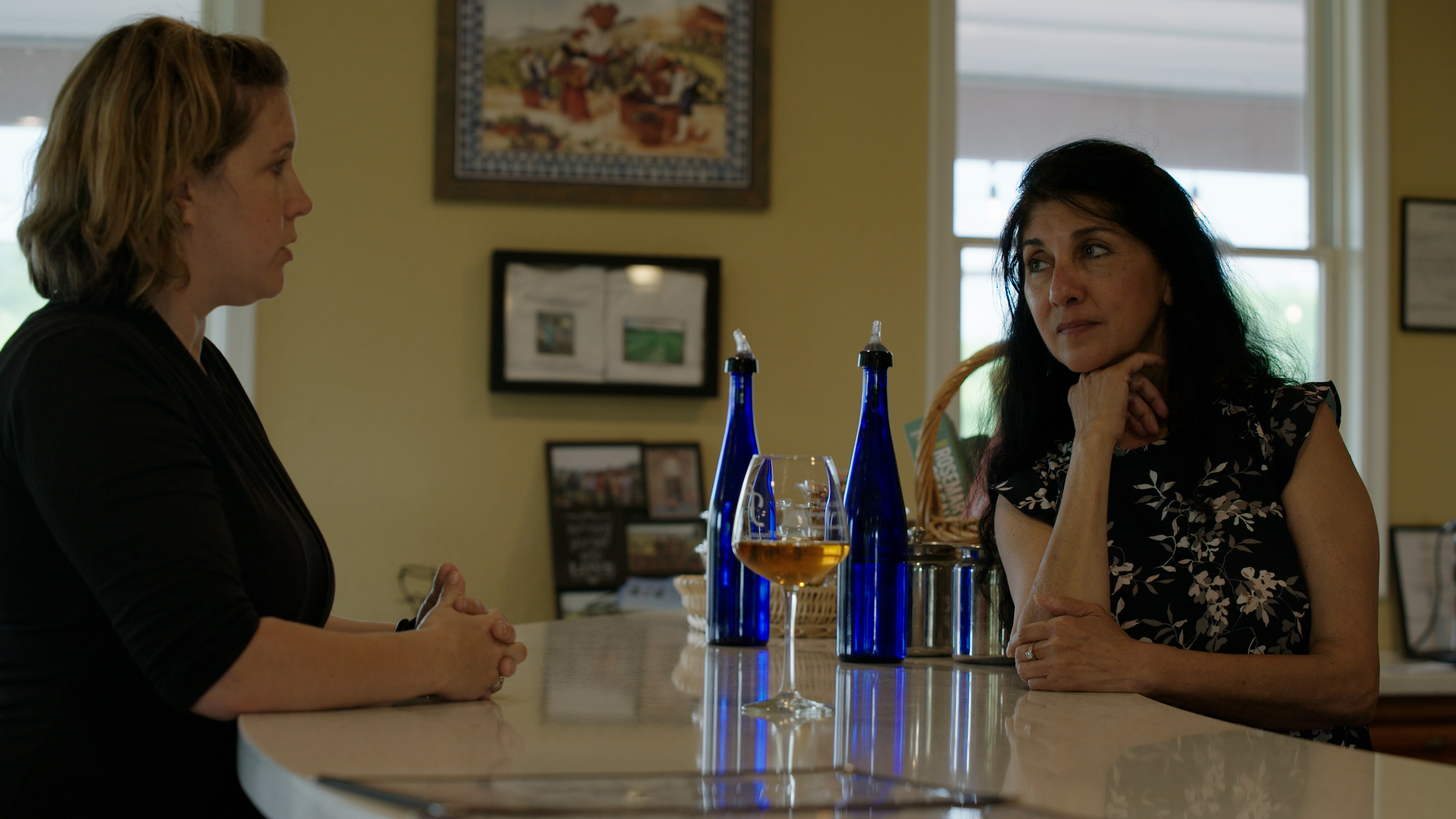 Guests enjoying wine and conversation at Fence Stile
