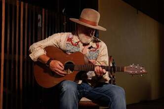 Jesse Harris performing for Acoustic in the Caves at Fence Stile