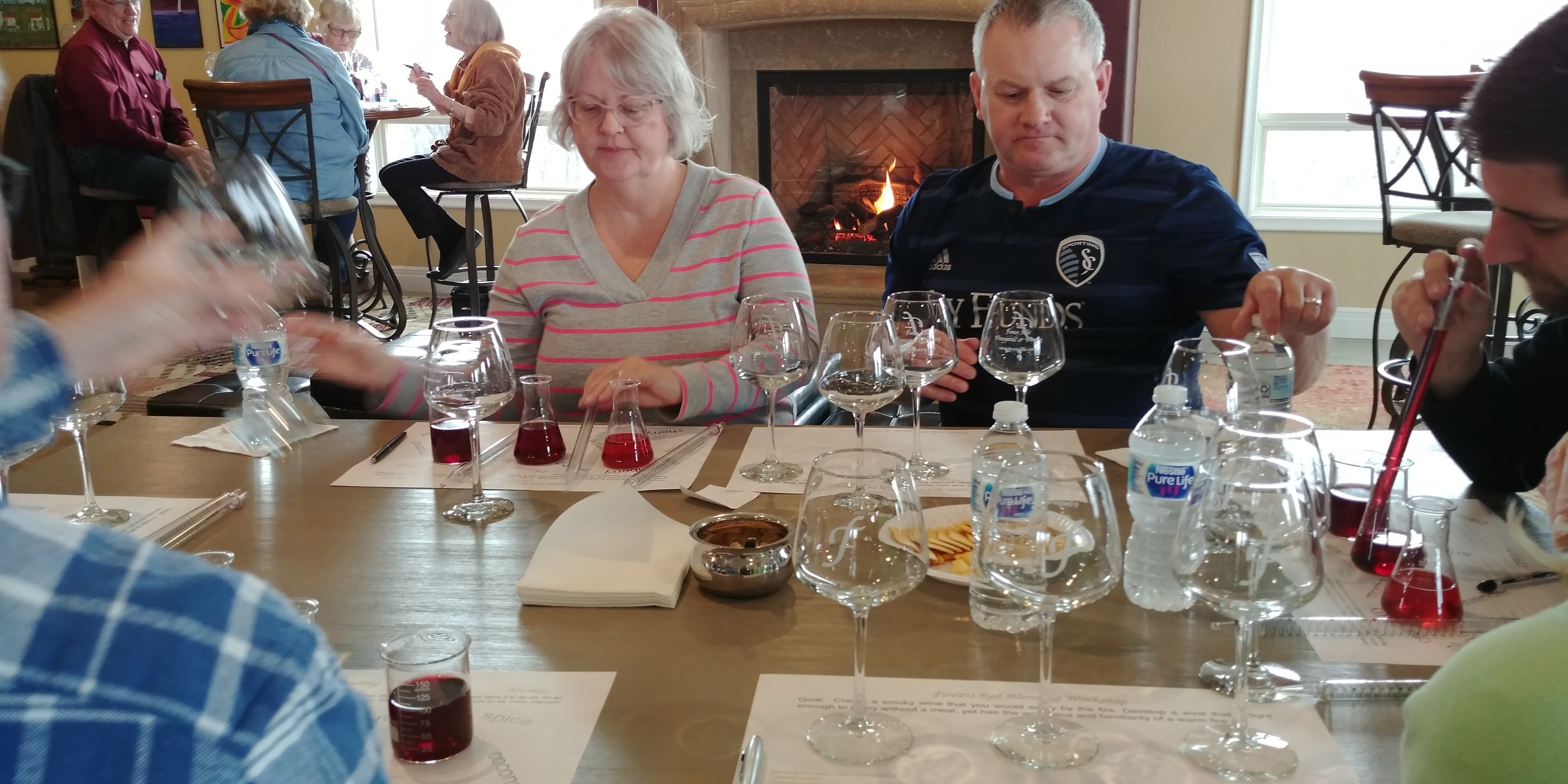 Guests comparing wine samples during a blending workshop at Fence Stile
