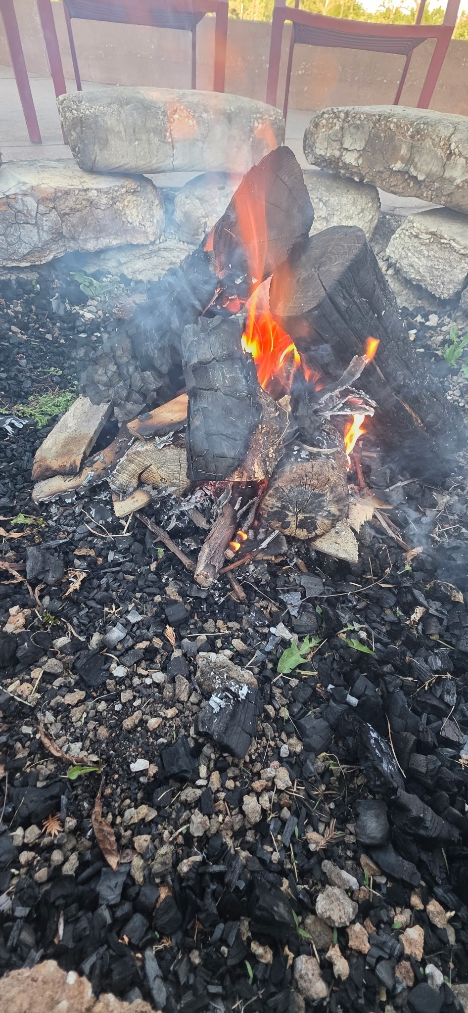 Fire burning in the Fence Stile patio firepit