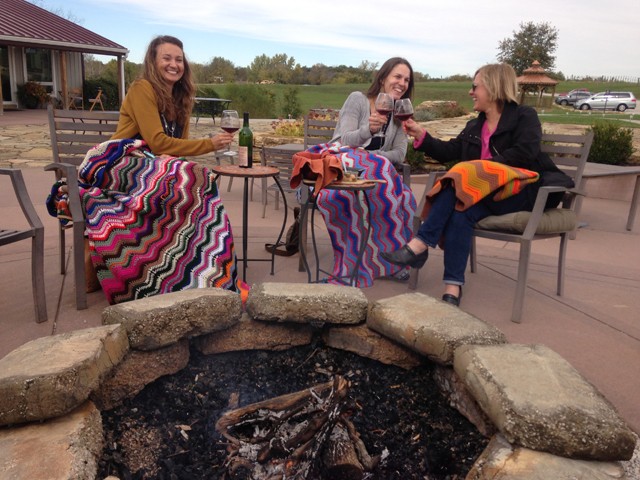 Guests relaxing by the firepit at Fence Stile