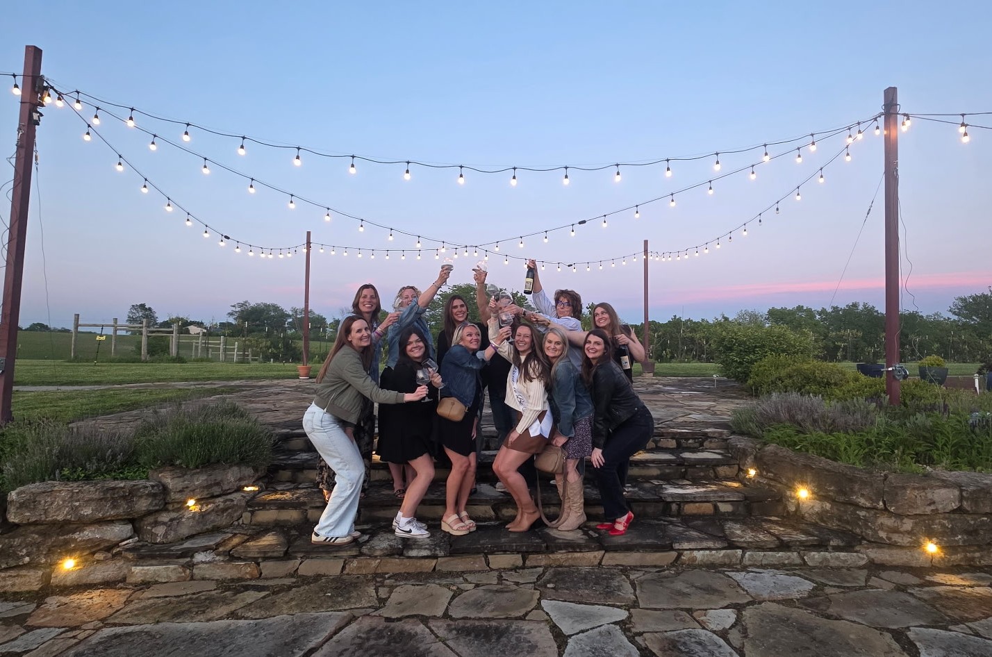 Guests raising glasses during a private celebration at Fence Stile