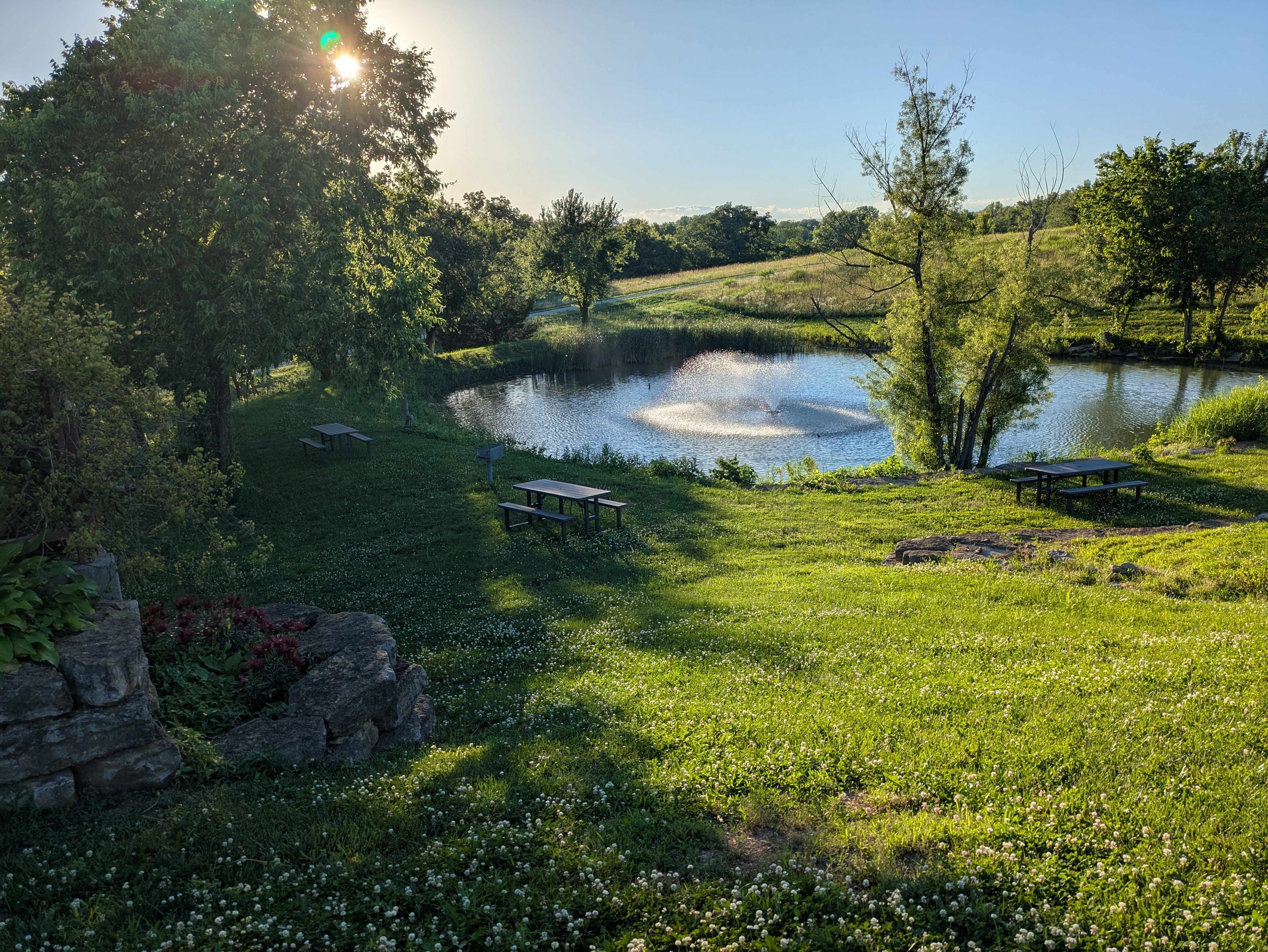 Fence Stile pond and countryside in the evening light
