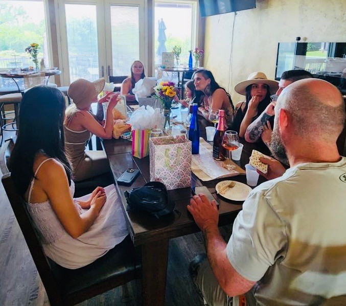 Group seated together for wine in the tasting room at Fence Stile