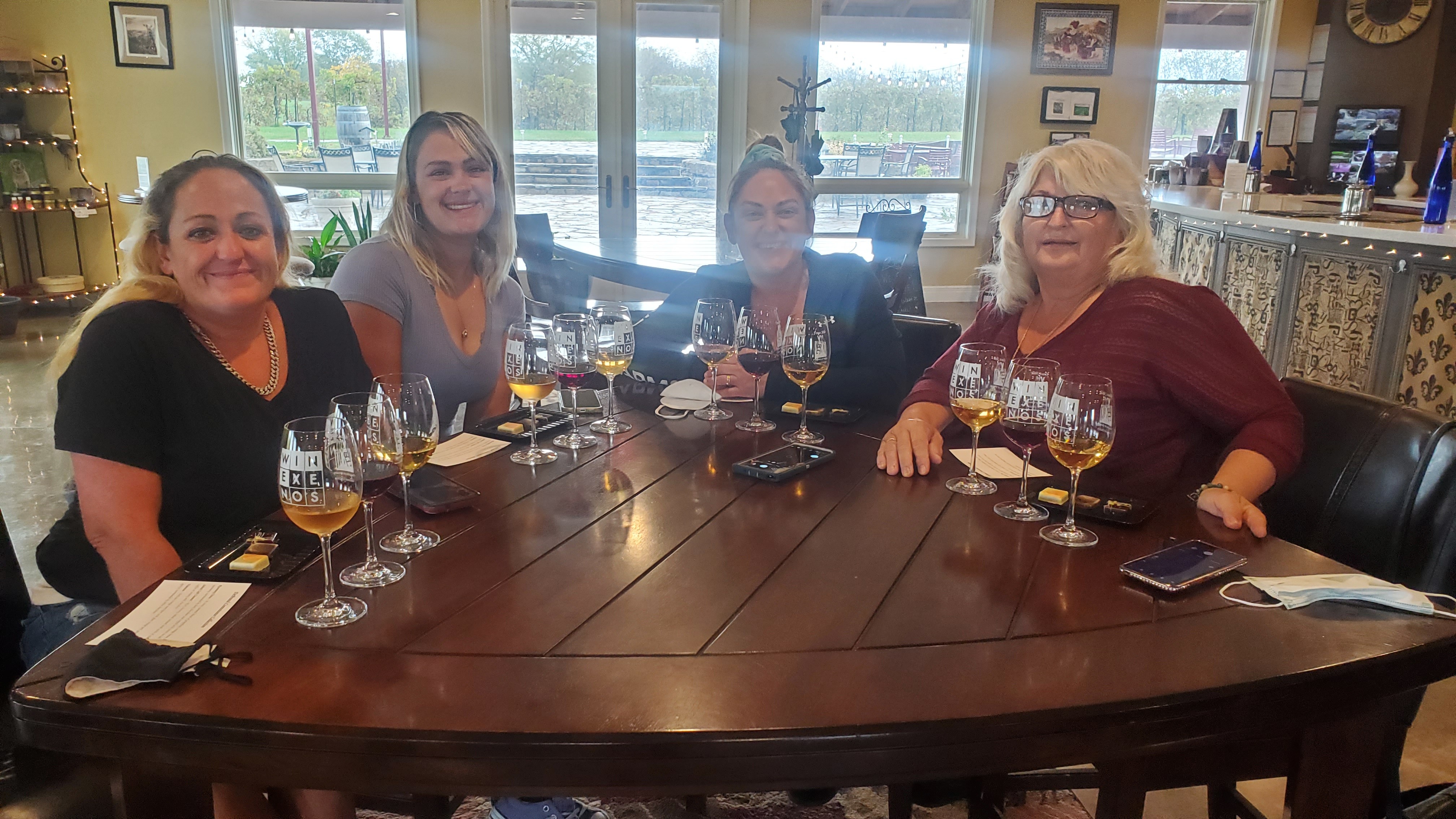 Small group tasting wines together at Fence Stile