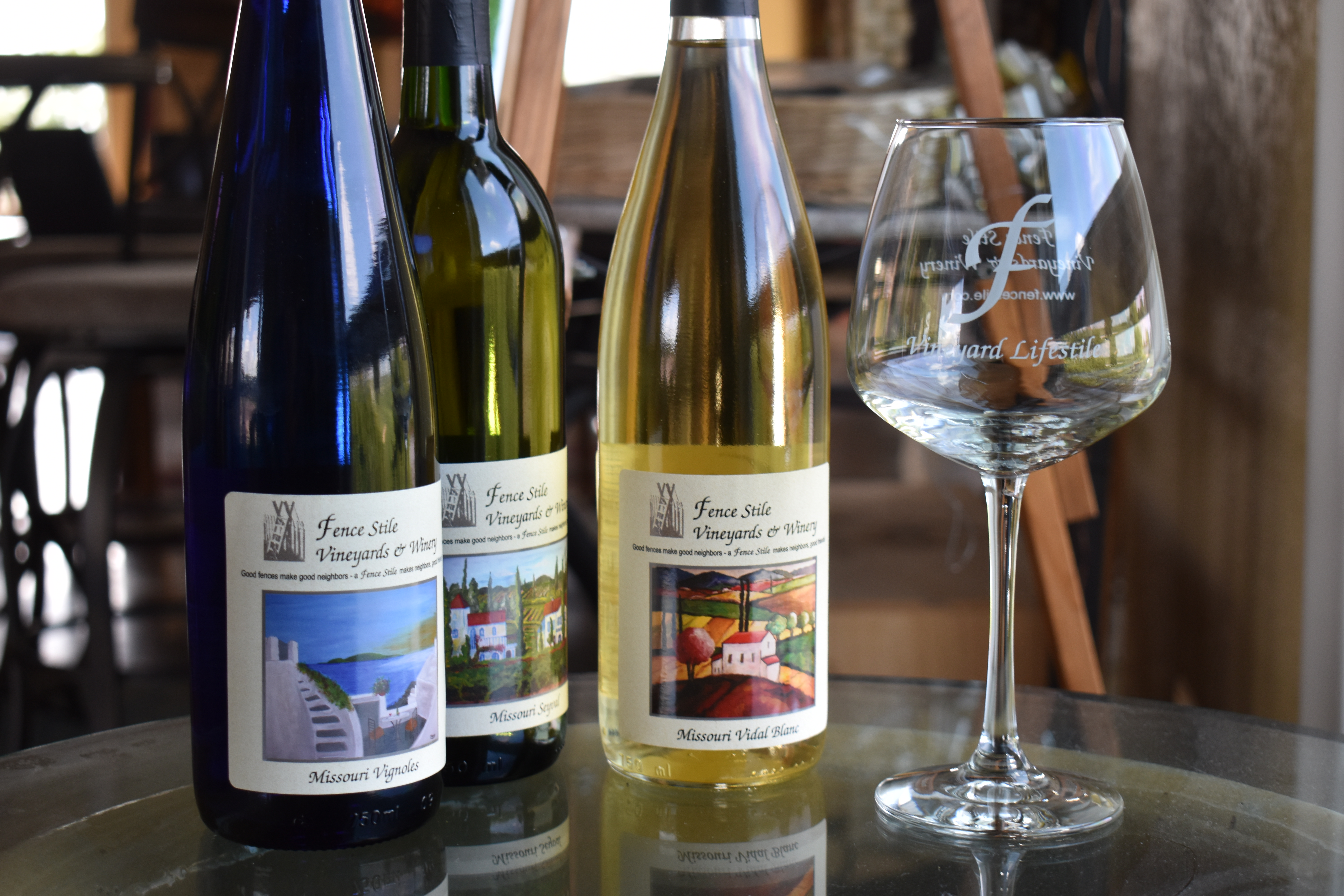 A lineup of Fence Stile wine bottles